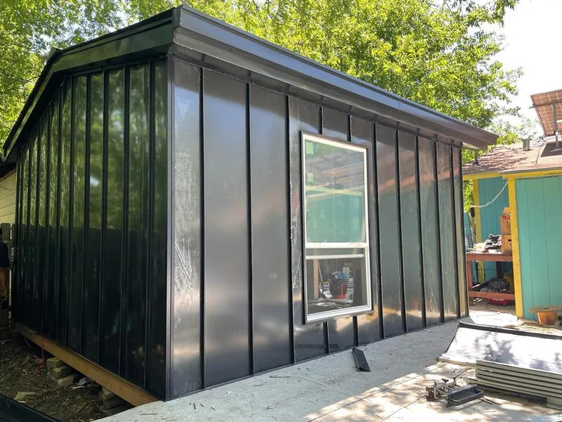 Black standing seam metal wall panels for Roof Inspection in Lutz